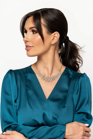 Shimmering Song - Gold - White Rhinestone Paparazzi Short Necklace - January 2023 Life of the Party Exclusive