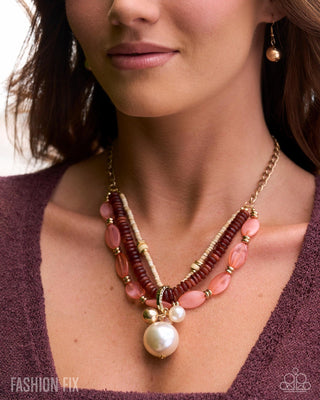 Boho Chic orange beaded necklace modeled