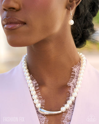White pearl necklace modeled close-up