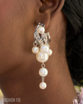 Pearl drop earrings modeled close-up